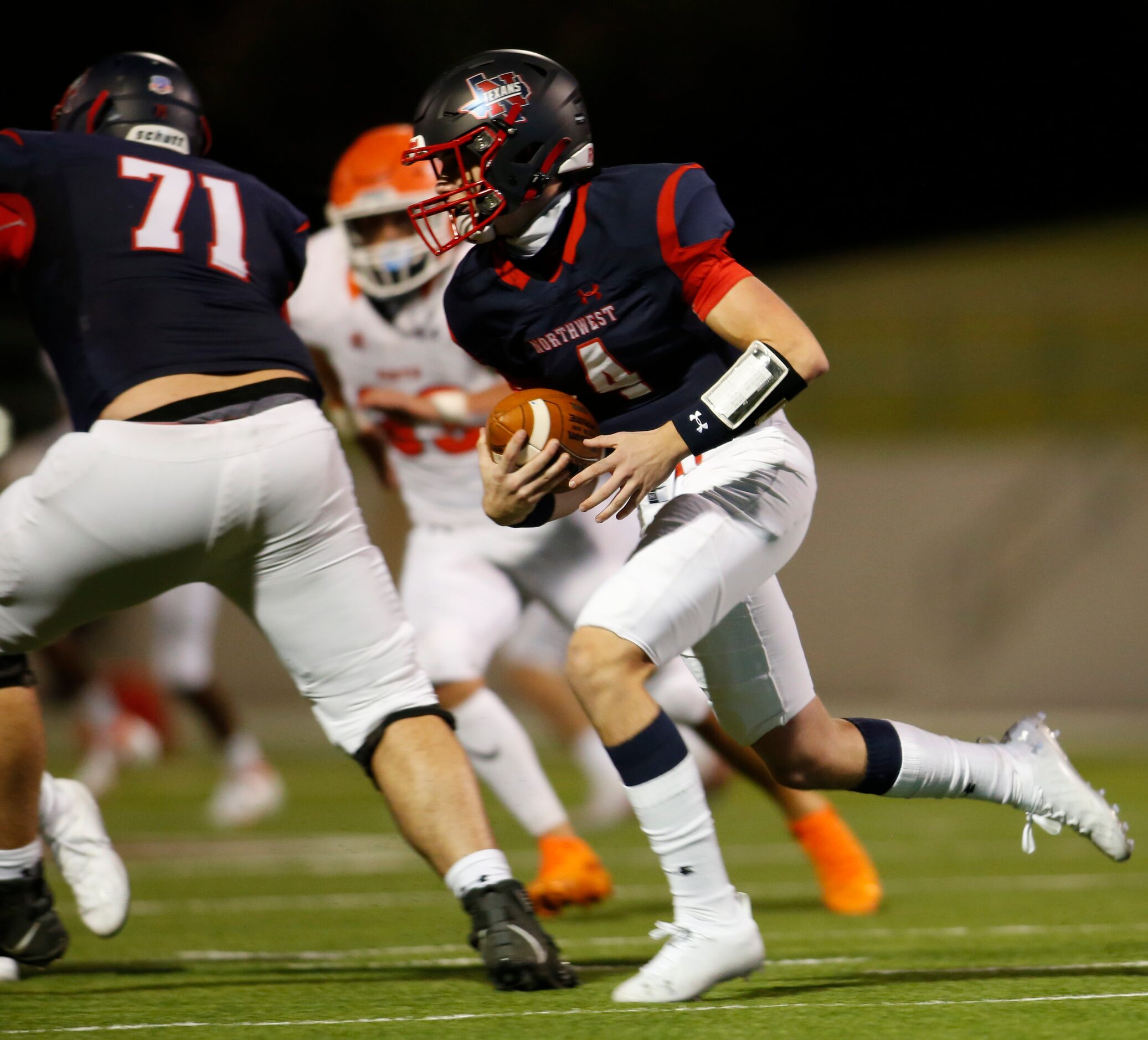 Northwest quarterback Jake Strong (4) looks for running room out of the backfield during...