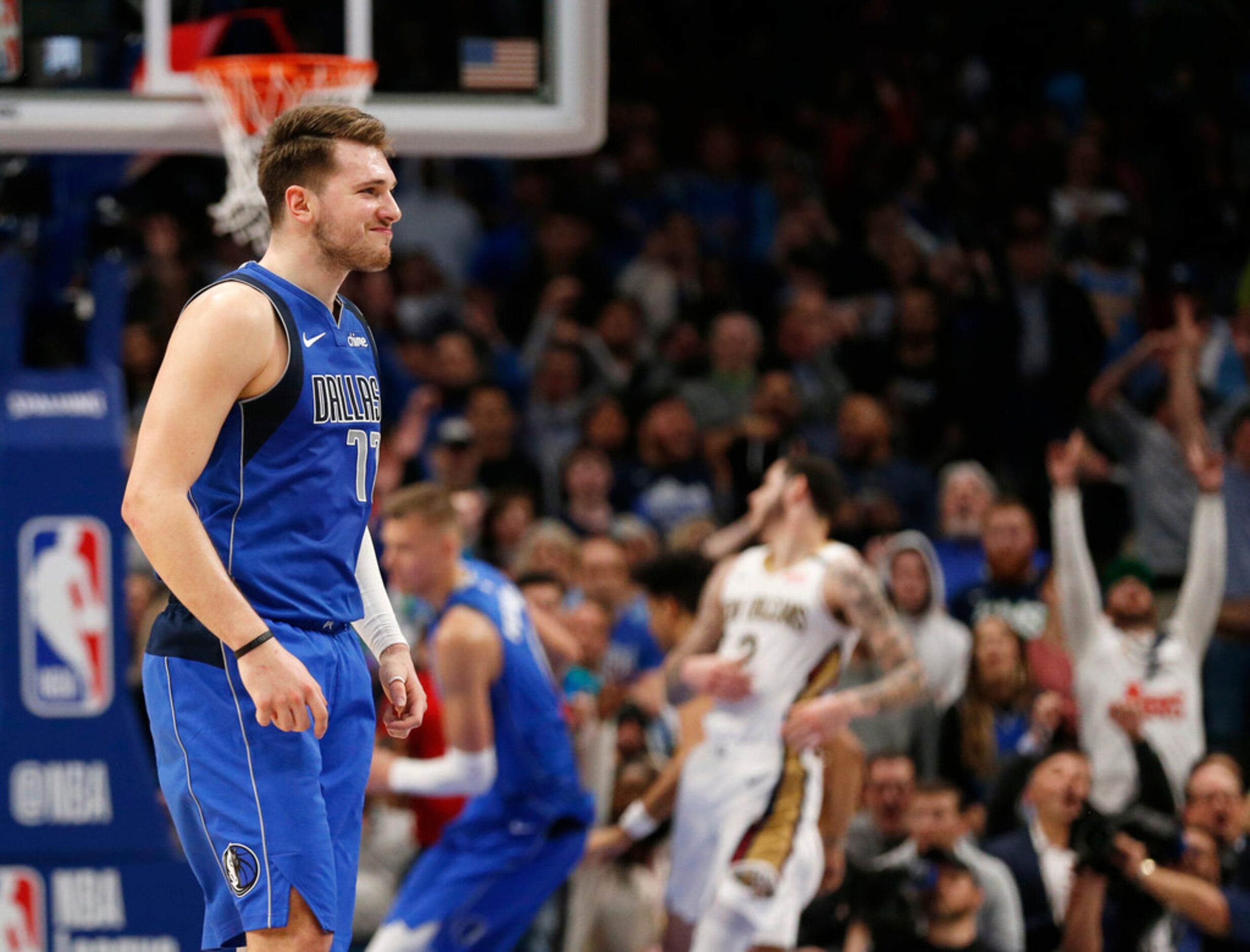 Dallas Mavericks guard Luka Doncic (77) smiles after making a three pointer late in overtime...