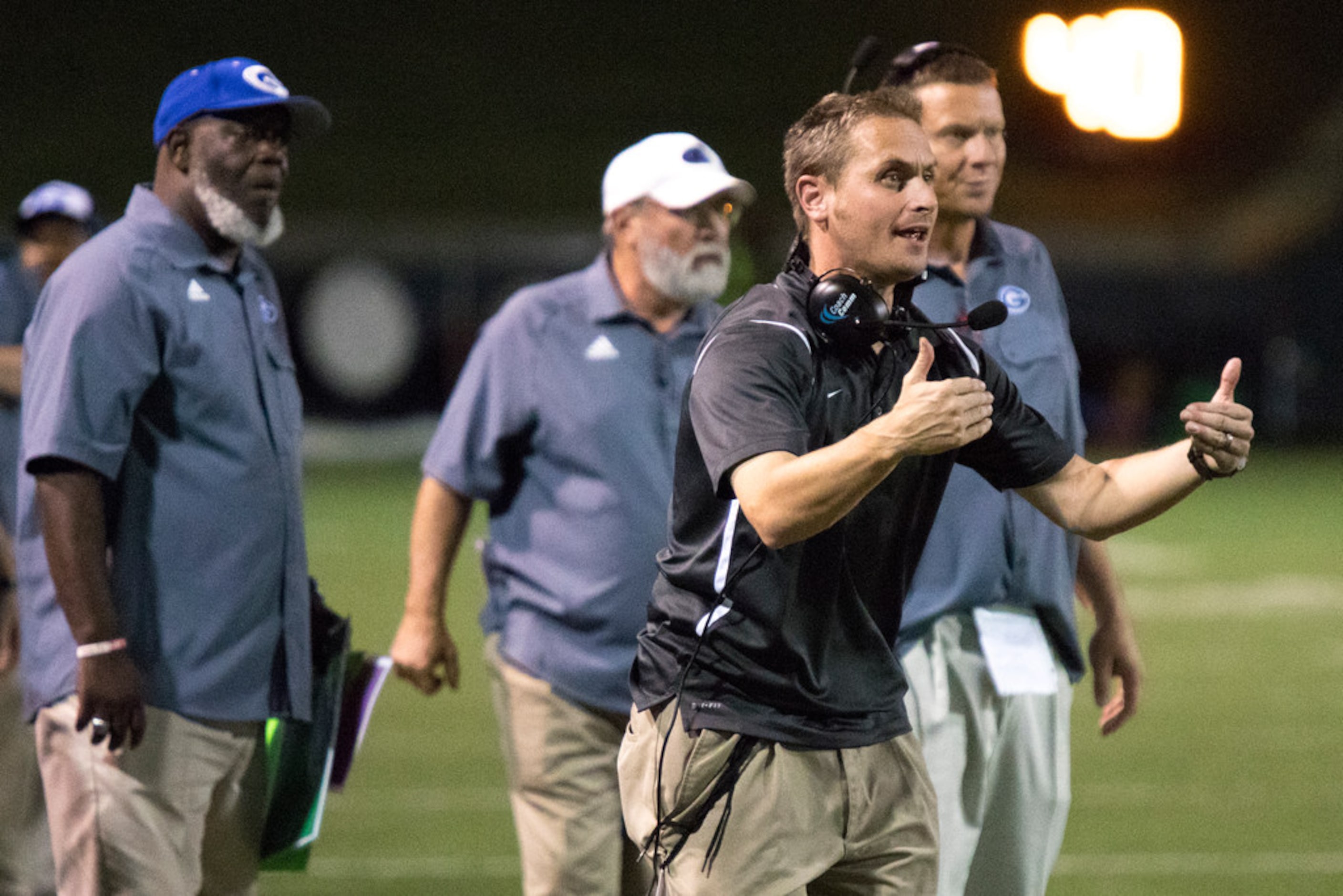 The Grand Prairie coaching team commands the Gophers during a District 7-6A matchup between...