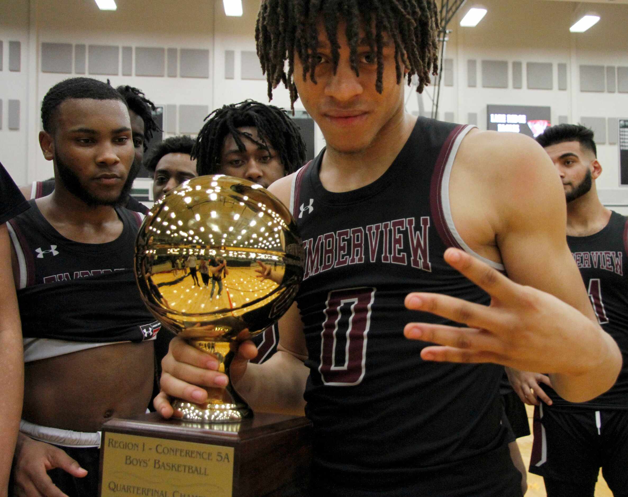 Mansfield Timberview senior guard Joey Marimba (0) clutches the Region 1 Class 5A...