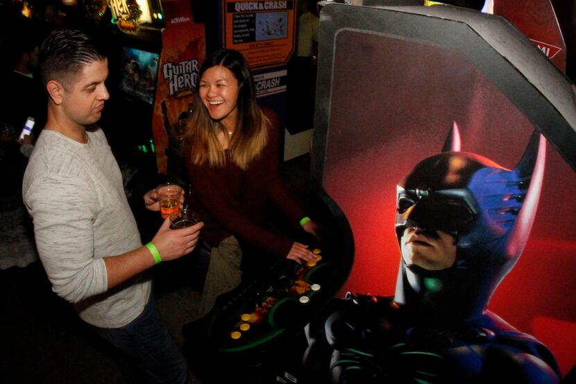 Tiffany Chen reacts to her score as her date, Michael Smith, handles the glasses of cider as...