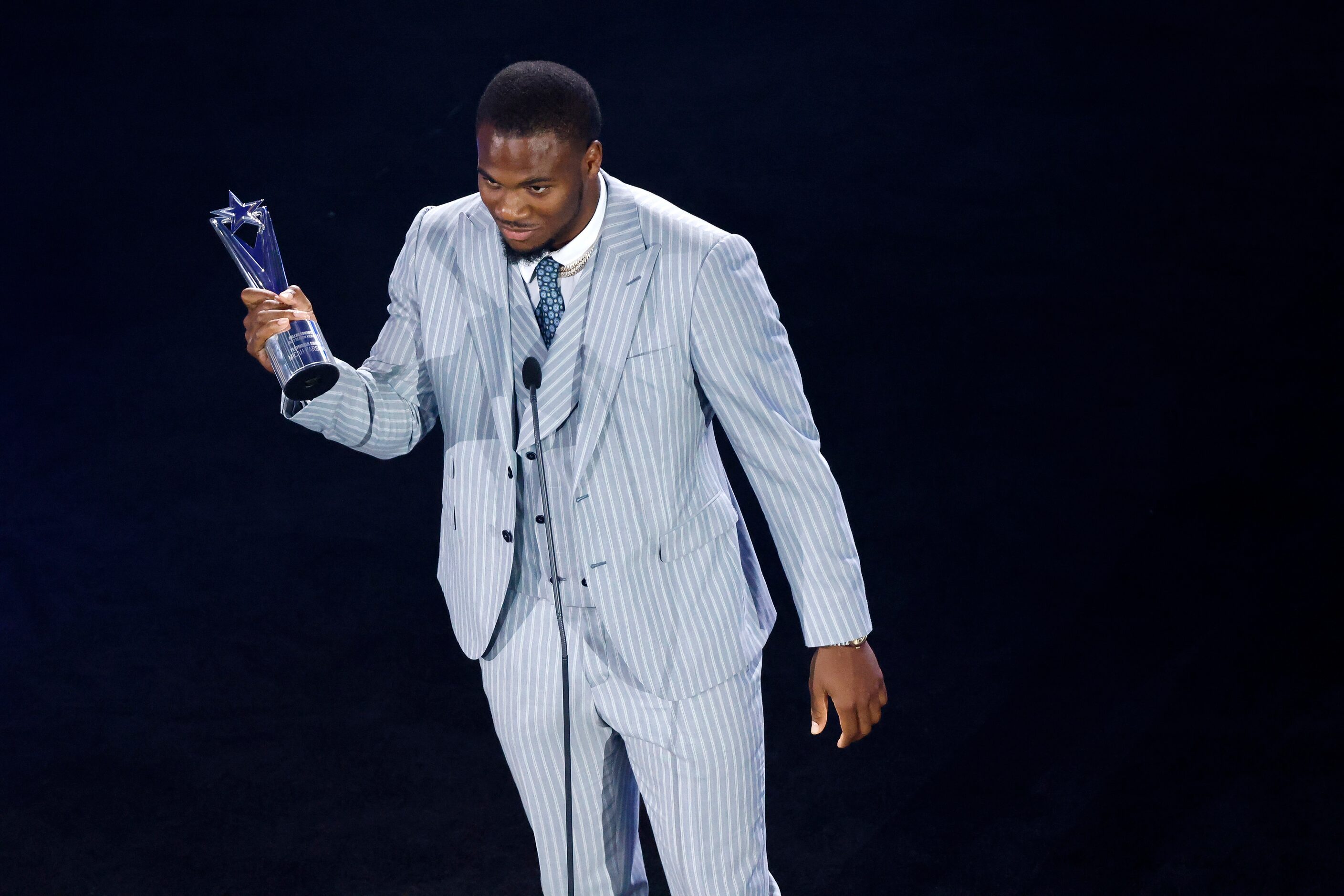 Dallas Cowboys linebacker Micah Parsons accepts The Playmaker Award and makes a speech at...