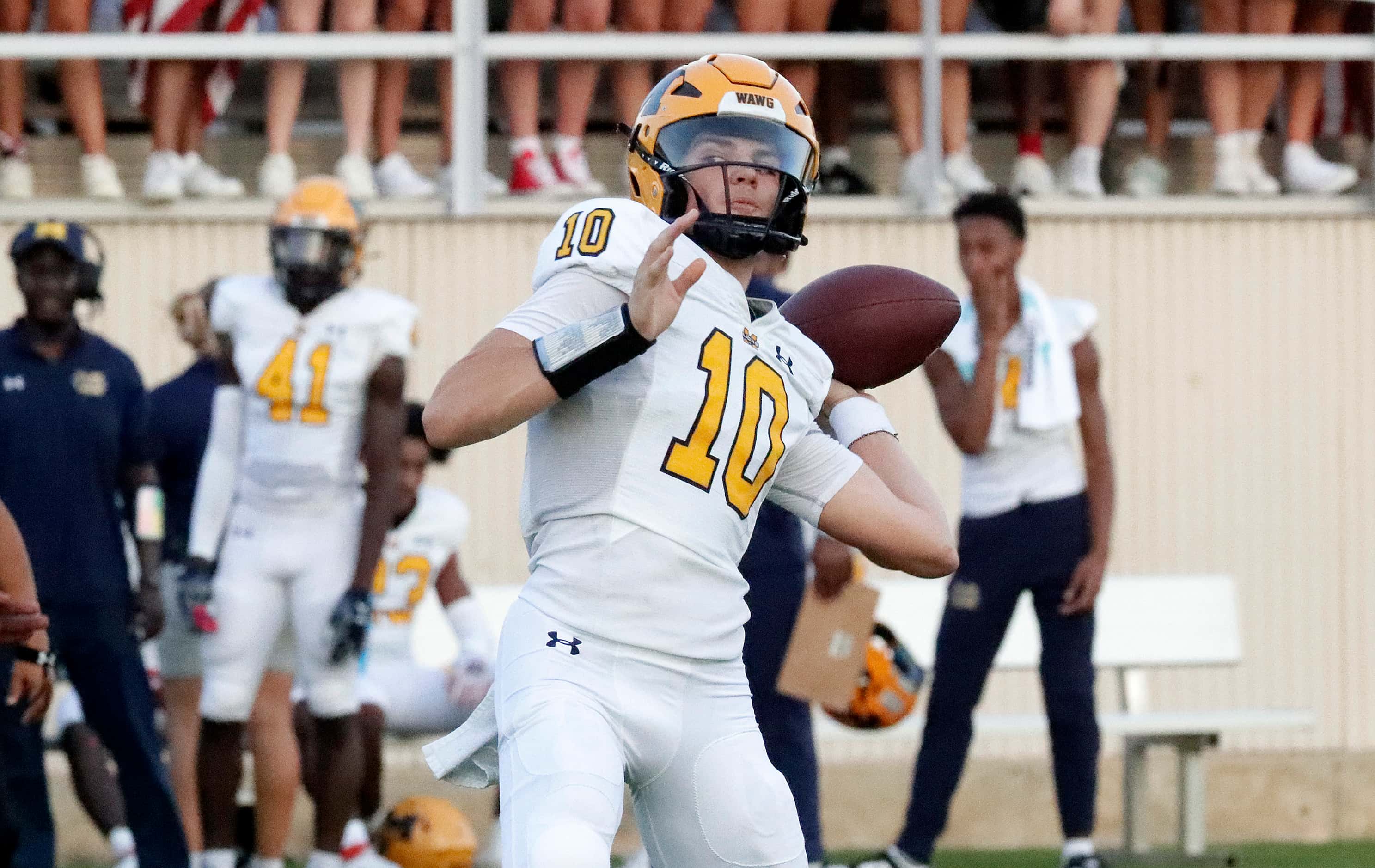 McKinney High School quarterback Jeremiah Daoud (10) throws a pass during the first half as...
