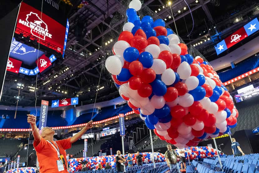 Bags of balloons are hoisted to the ceiling in the Fiserv Forum ahead of the 2024 Republican...