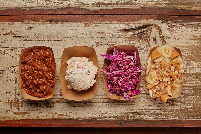 Side dishes include pinto beans (left) and baked potato salad (second from left) at Heim...