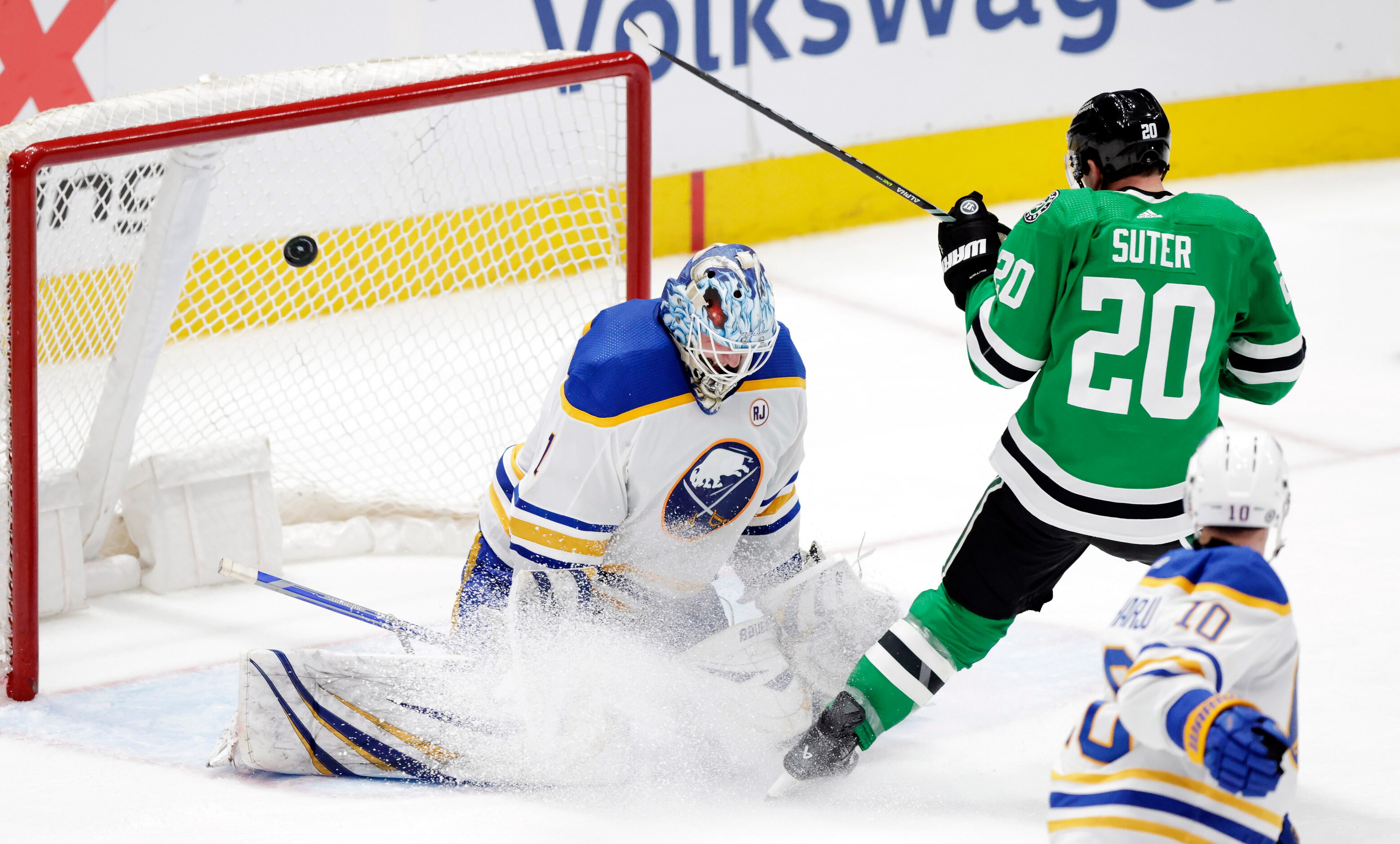 Dallas Stars defenseman Ryan Suter’s (20) shot sails over Buffalo Sabres goaltender...