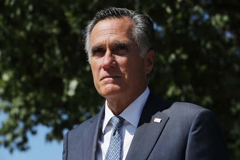 Sen. Mitt Romney, R-Utah, leaves a meeting of GOP senators at the National Republican...