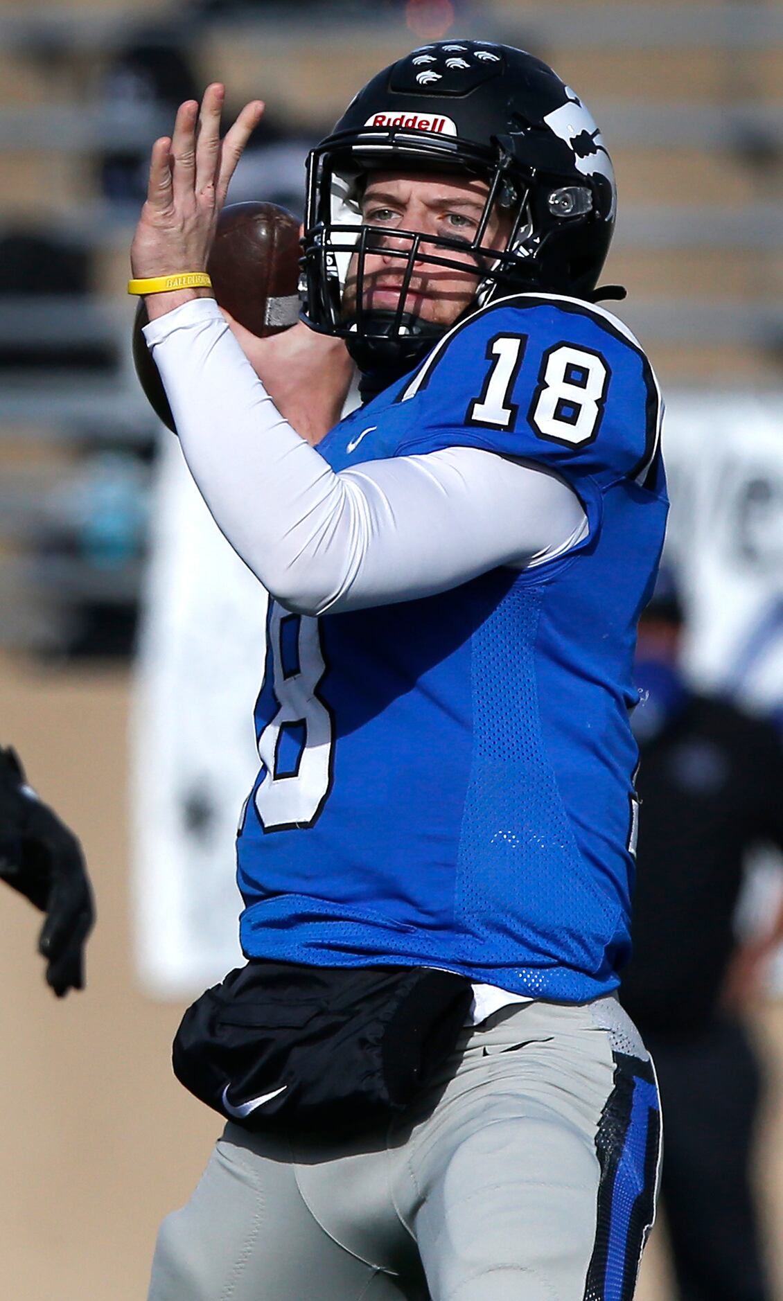 Plano West High School quarterback Greg Draughn (18) throws a pass during the first half as...