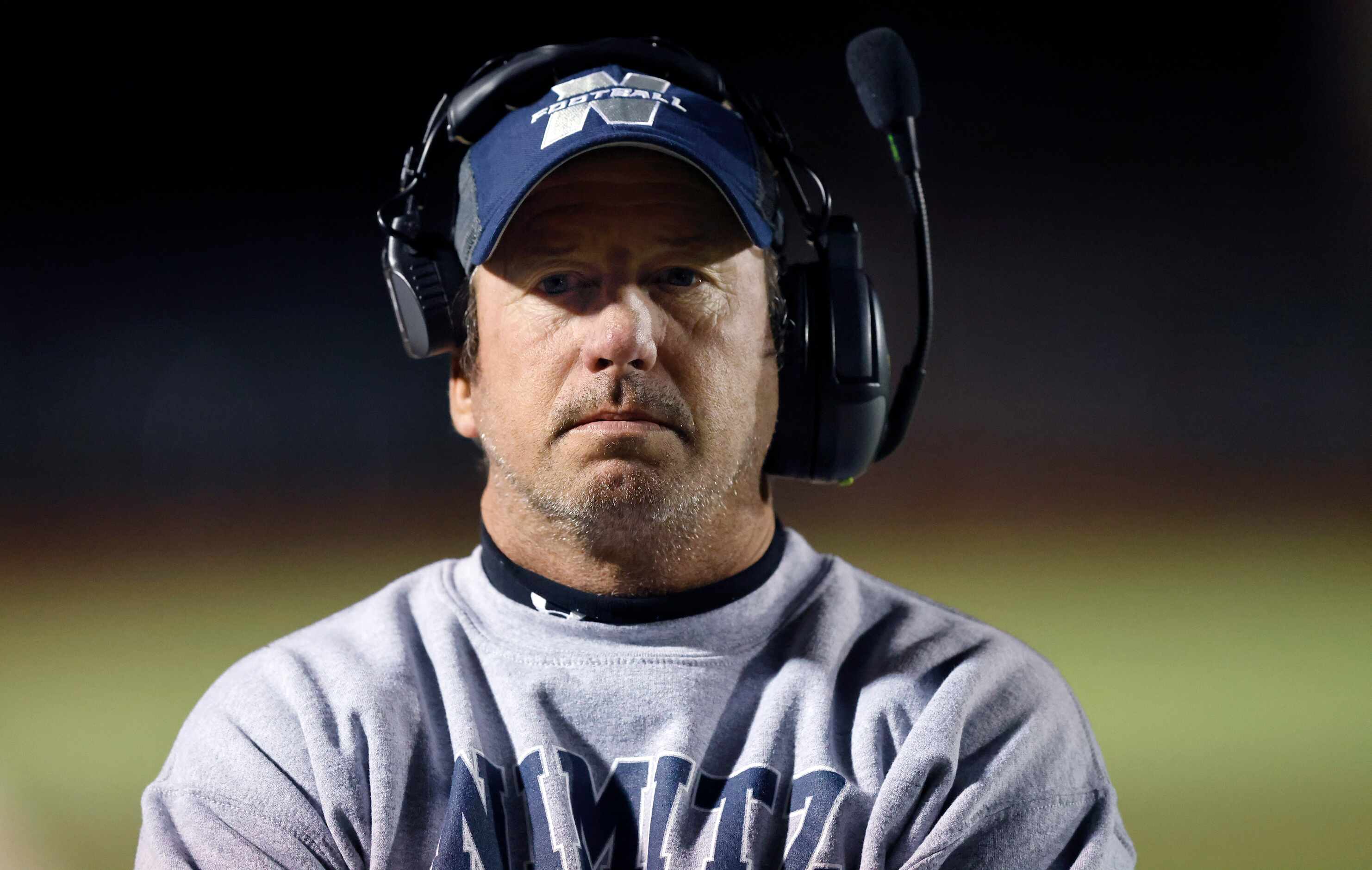 Irving Nimitz head football coach Brian Rogers is pictured on the sideline during the first...