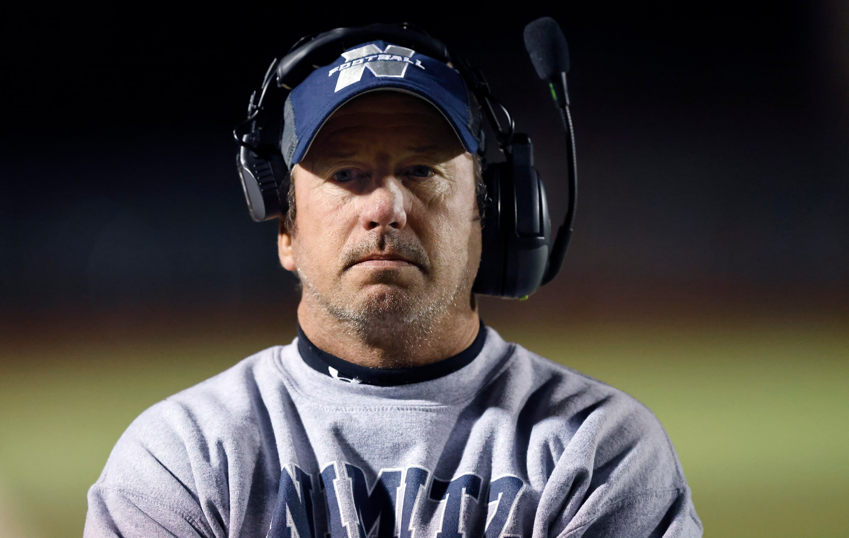 Irving Nimitz head football coach Brian Rogers is pictured on the sideline during the first...