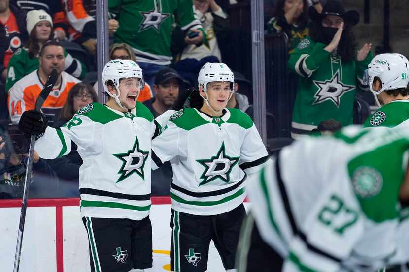 Dallas Stars' Matej Blumel, left, and Nils Lundkvist celebrate with teammates after a goal...