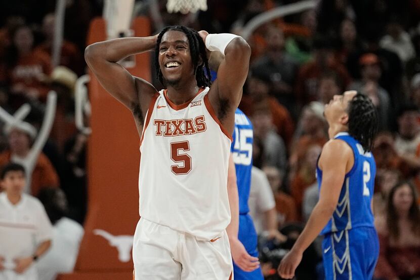 Texas guard Marcus Carr (5) smiles after a play against Creighton during the second half of...
