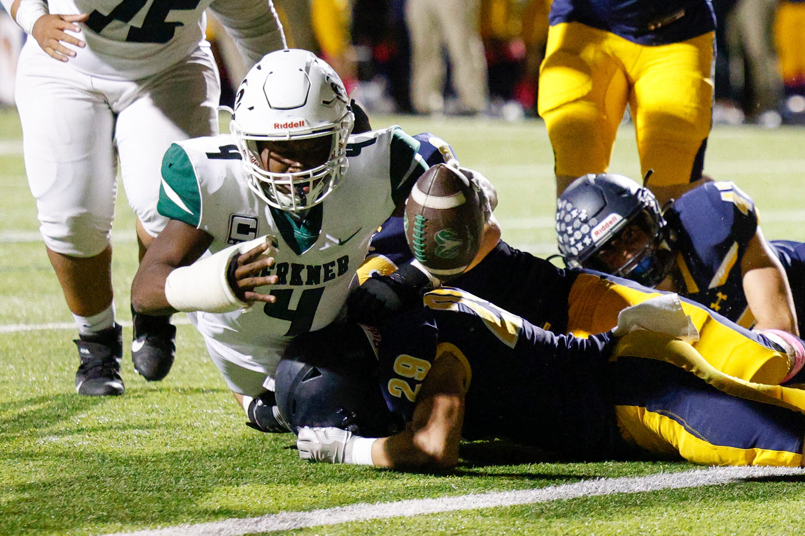 Highland Park cornerback Matias Tamacas (28) tackles Richardson Berkner running back Jamary...