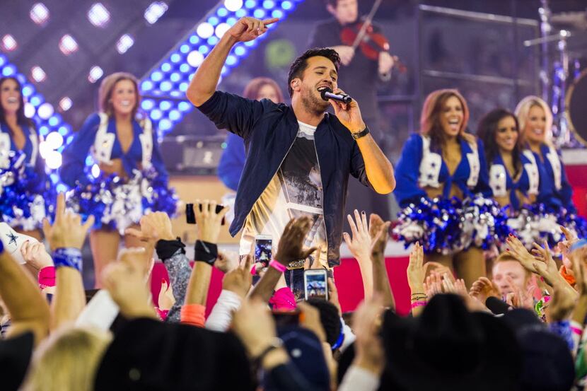 Luke Bryan performs during the half time show of the Dallas Cowboys v. Caroline Panthers...