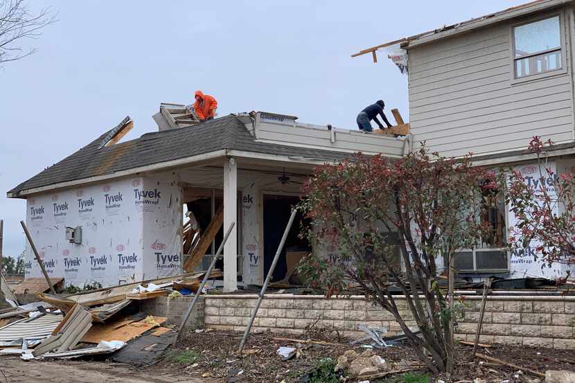 Workers are demolishing this house on Wimberley Court, near Walnut Hill and Marsh lanes in...