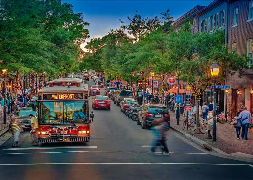 A trolley rolls down King Street, a popular stretch of Alexandria with more than 160 shops...