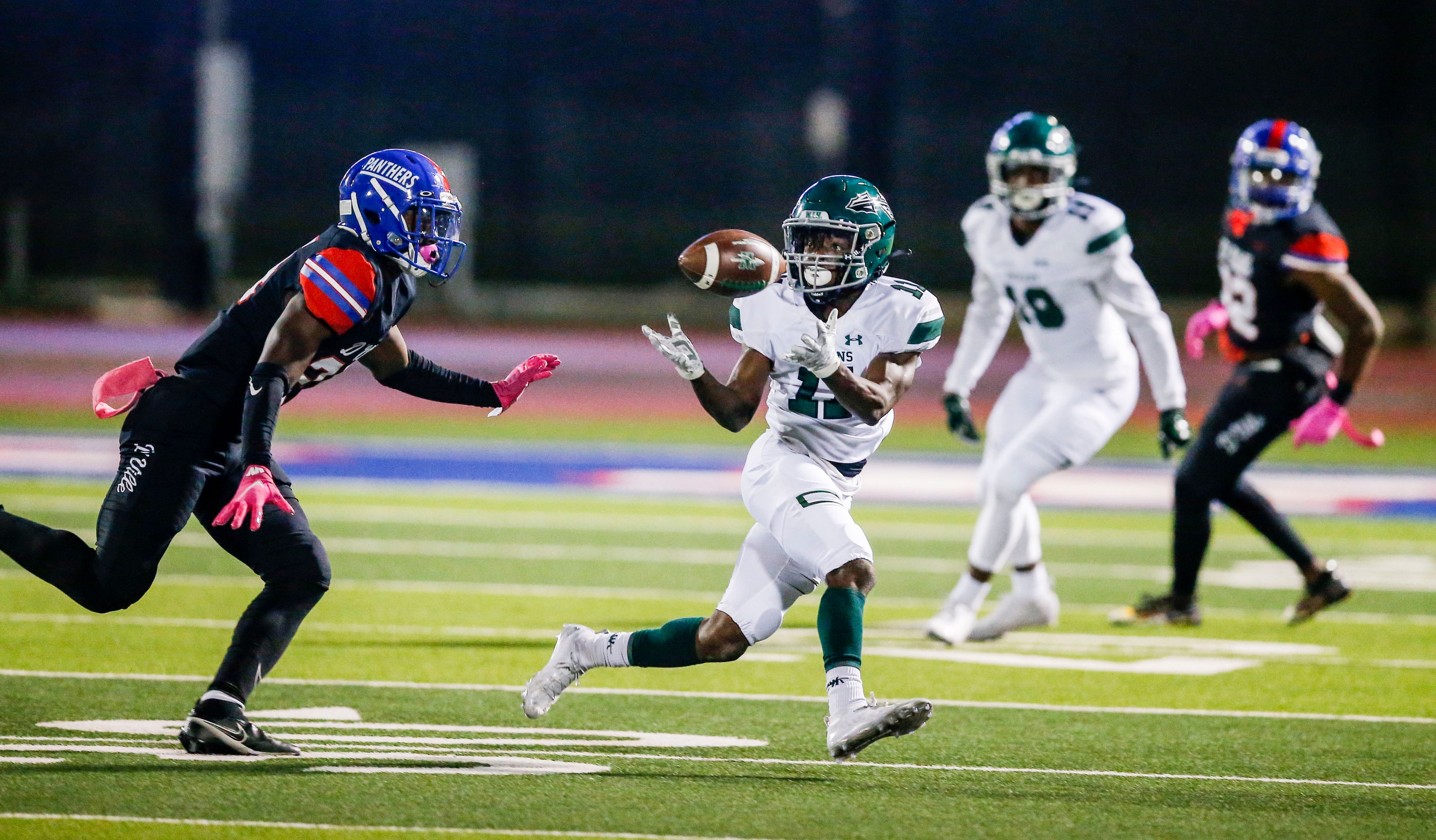 Waxahachie junior wide receiver Blair Hawkins (11) catches a pass as Duncanville sophomore...