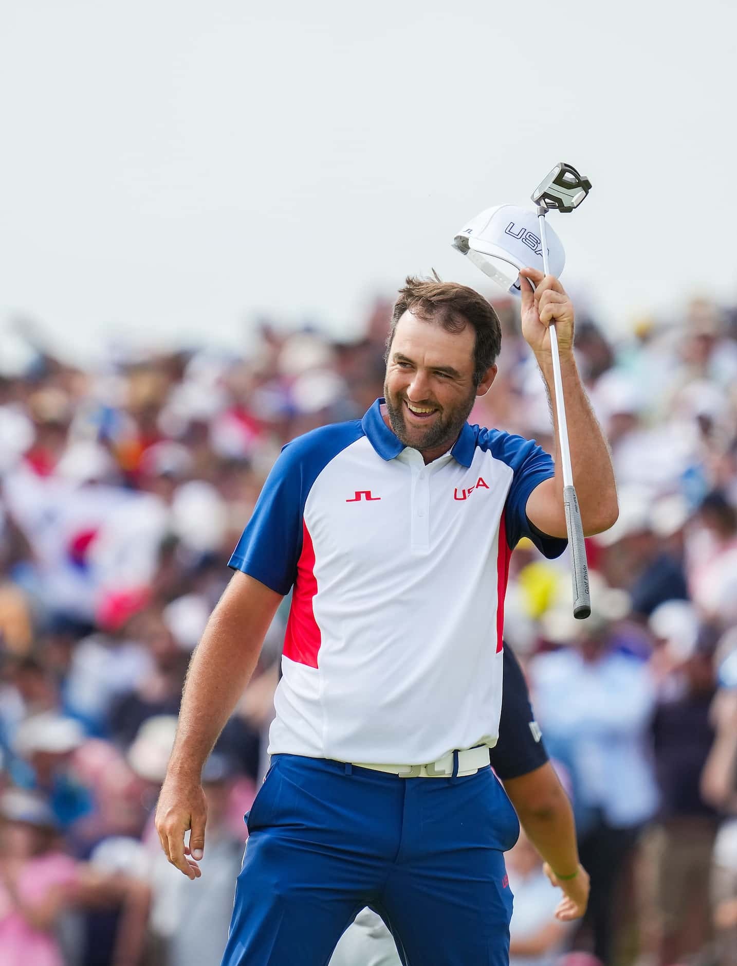 Scottie Scheffler of the United States celebrates on the 18th green after the final round of...