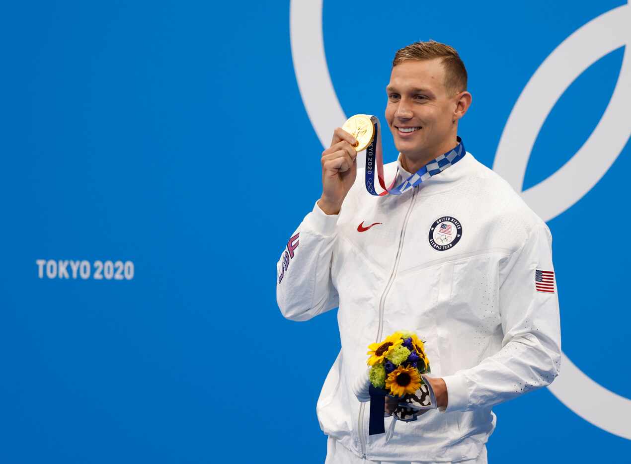 USA’s Caeleb Dressel poses for photographers after  receiving his gold medal during the...