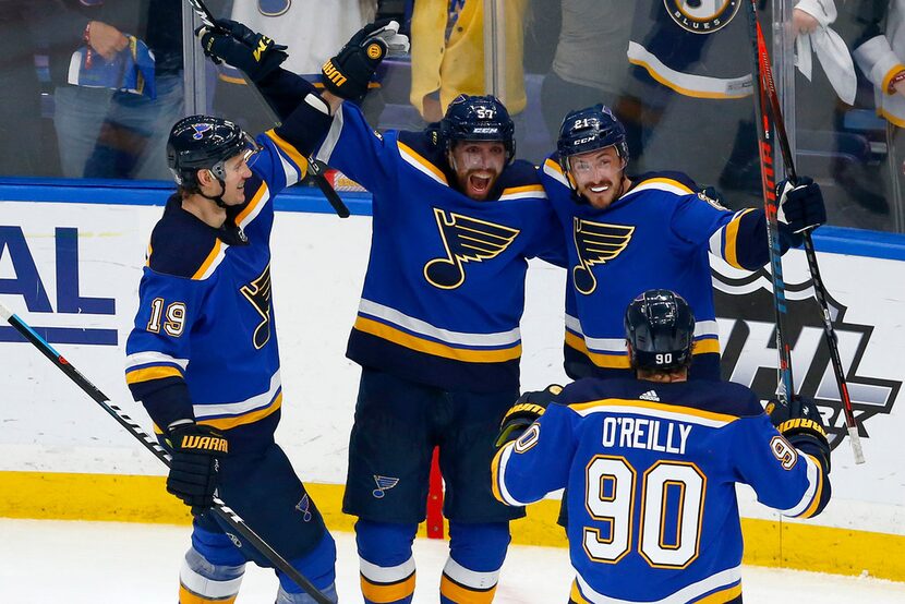 ST LOUIS, MISSOURI - MAY 21: Tyler Bozak #21 of the St. Louis Blues celebrates with...