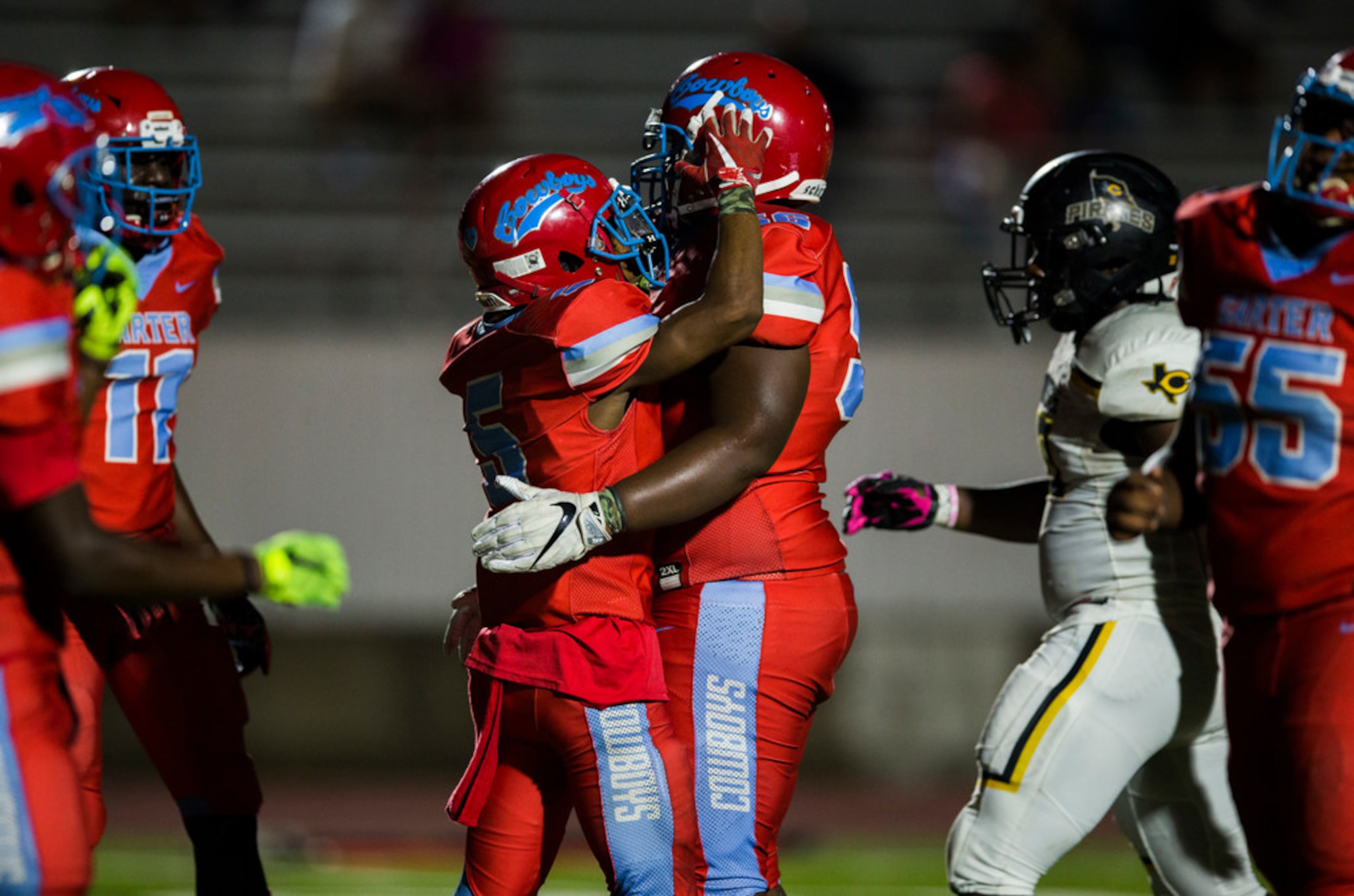 Carter wide receiver Tailon Garrett (5) and offensive lineman Cameron Anderson (56)...