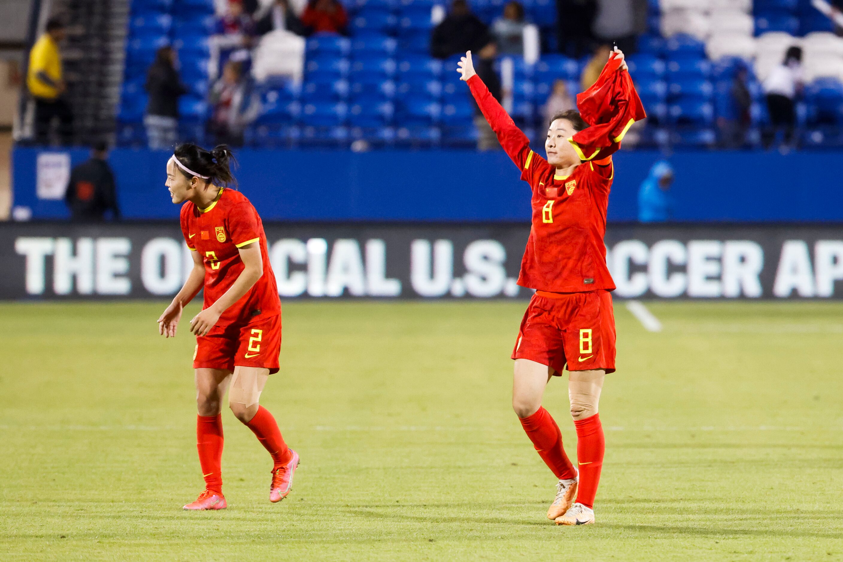 China soccer players wave towards the crowd after a soccer game against United States, on...