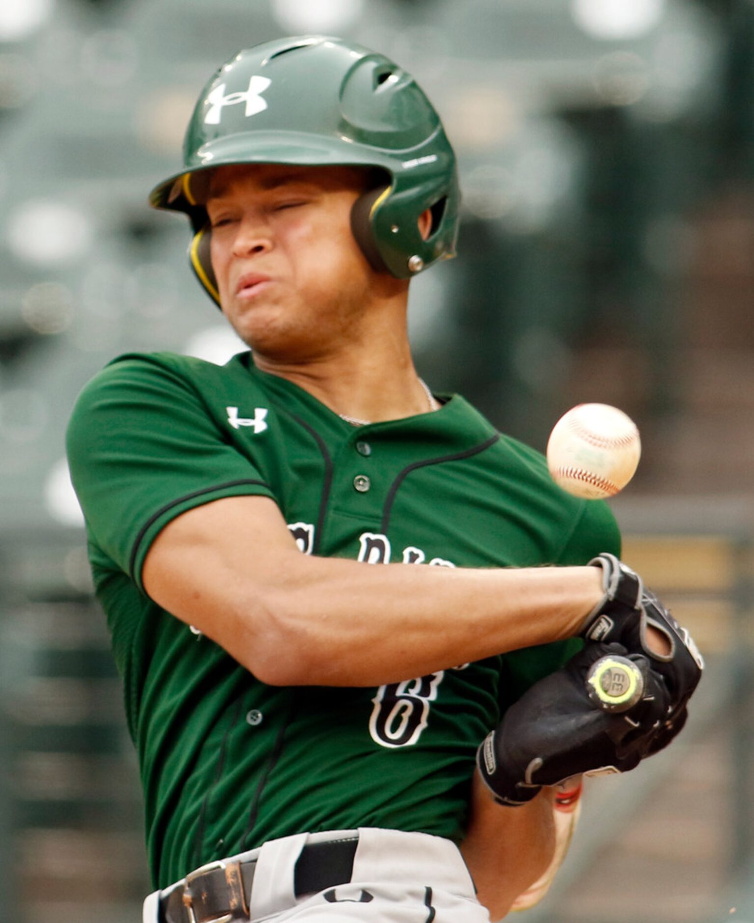 Mansfield Lake Ridge infielder Talon Simmons (6) winces after a strong swing resulted in the...