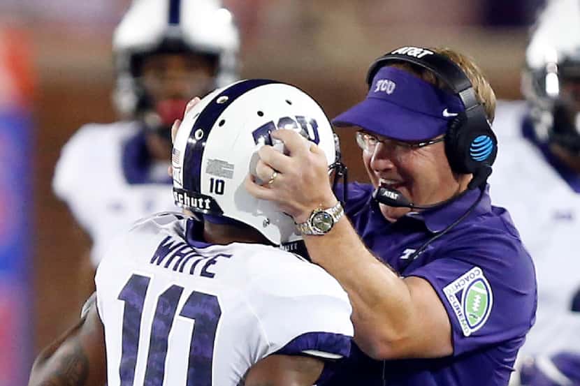 TCU Horned Frogs head coach Gary Patterson is excited after punt returner Desmon White (10)...