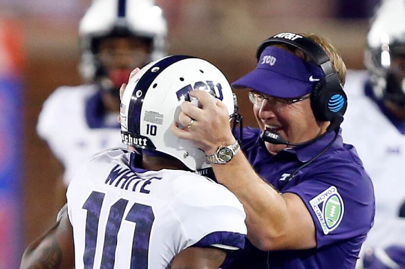 TCU Horned Frogs head coach Gary Patterson is excited after punt returner Desmon White (10)...