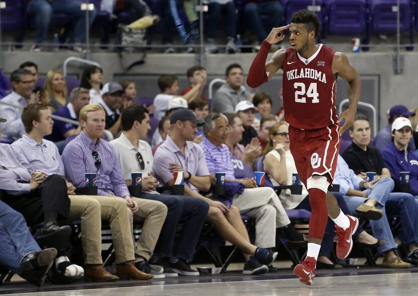 Oklahoma's Buddy Hield (24) gives a 3-point salute during the second half against Texas...