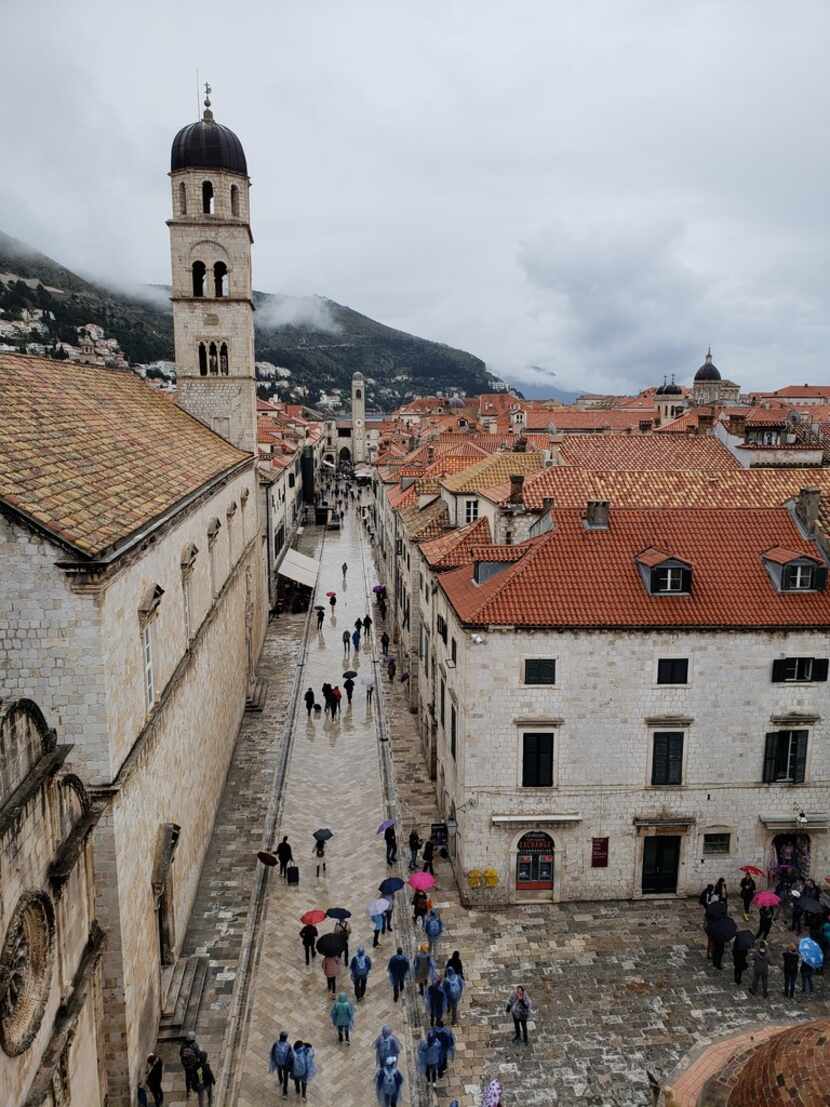 The limestone-paved Stradun, the broad main boulevard of Dubrovnik, is lined with shops and...