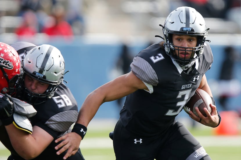 Denton Guyer High School quarterback Eli Stowers (3) runs the football behind a block from...