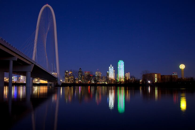 Spanning the flooded Trinity River between downtown and West Dallas, the Margaret Hunt Hill...