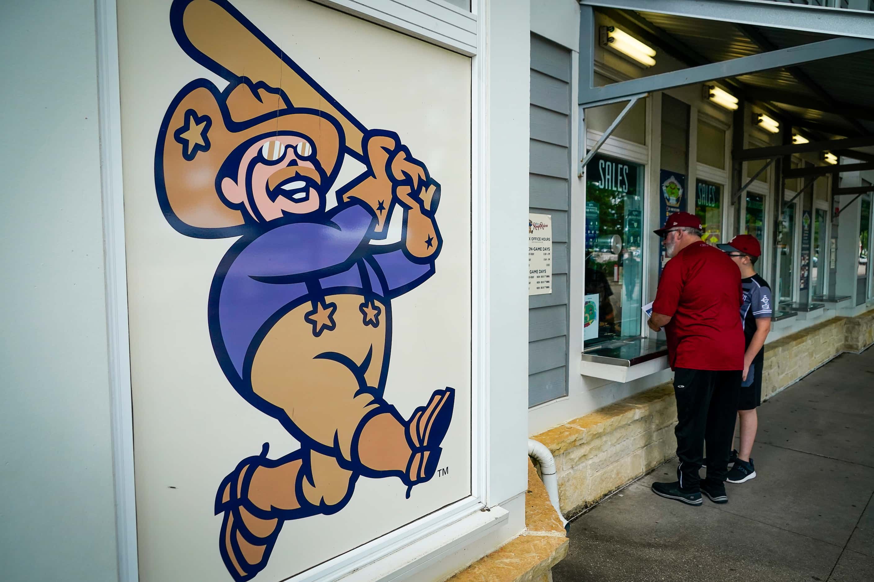 Fans visit the ticket window before the Frisco RoughRiders season opener against the Midland...