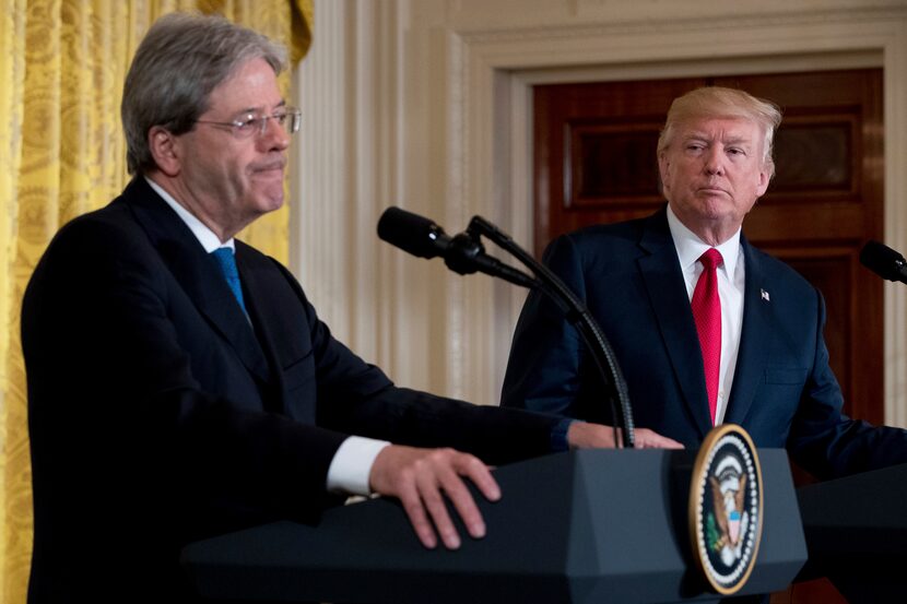 President Donald Trump watches as Italian Prime Minister Paolo Gentiloni fields a question...