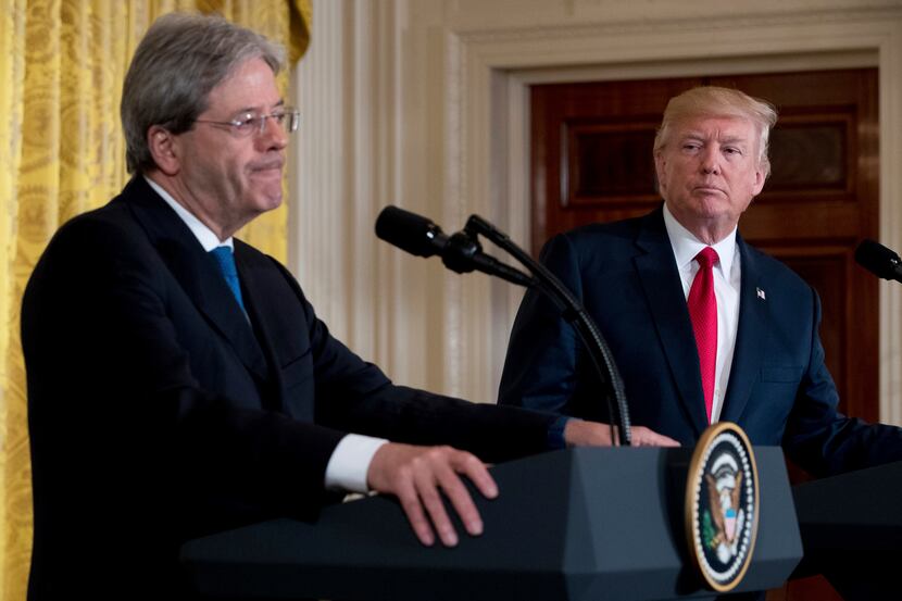 President Donald Trump watches as Italian Prime Minister Paolo Gentiloni fields a question...