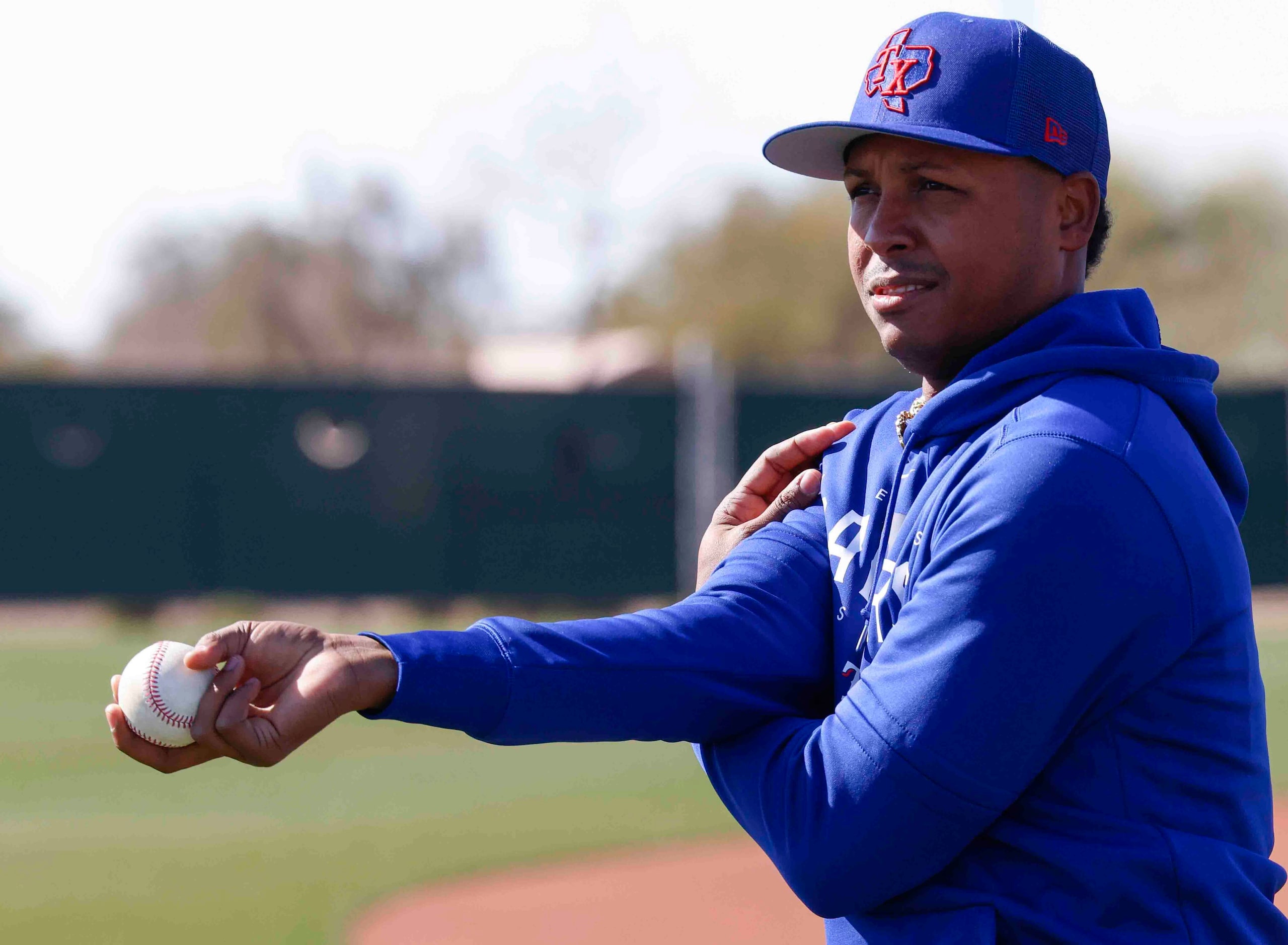 Texas Rangers right handed pitcher Jose Leclerc stretches during a spring training workout...