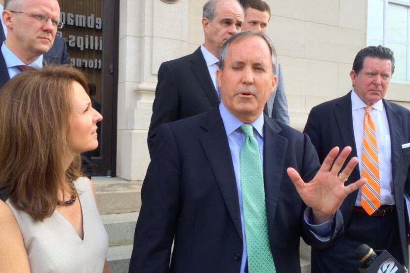 Texas Attorney General Ken Paxton speaks on Friday, Sept. 2, 2016, outside the federal...