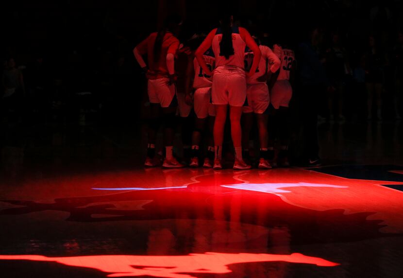 The Southern Methodist Mustangs huddle prior to a NCAA women's basketball matchup between...