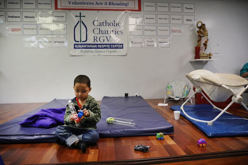 A Honduran child plays at the Catholic Charities Humanitarian Respite Center in McAllen...
