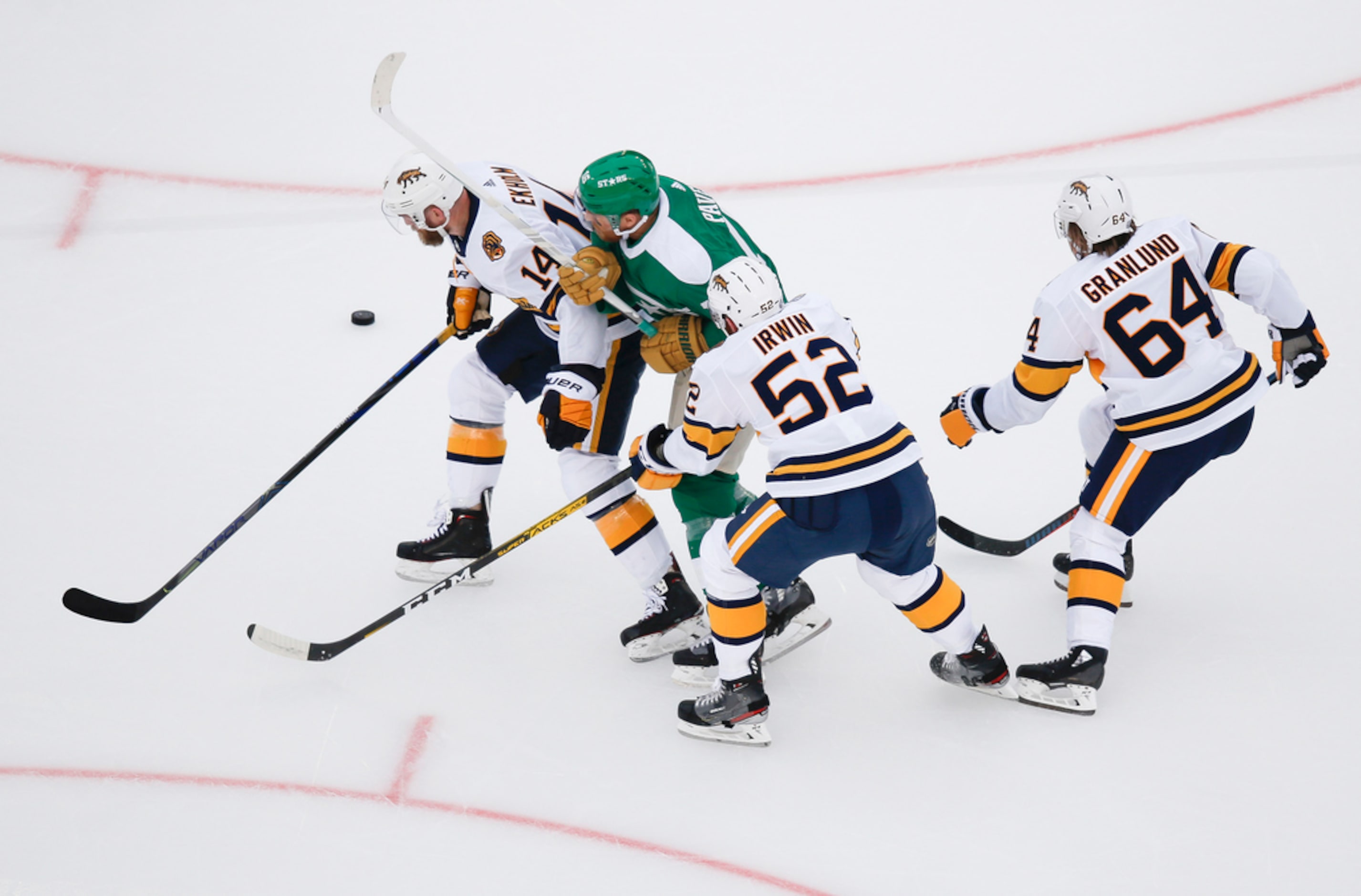 Dallas Stars center Joe Pavelski (16) is sandwiched by 

Nashville Predators defenseman...