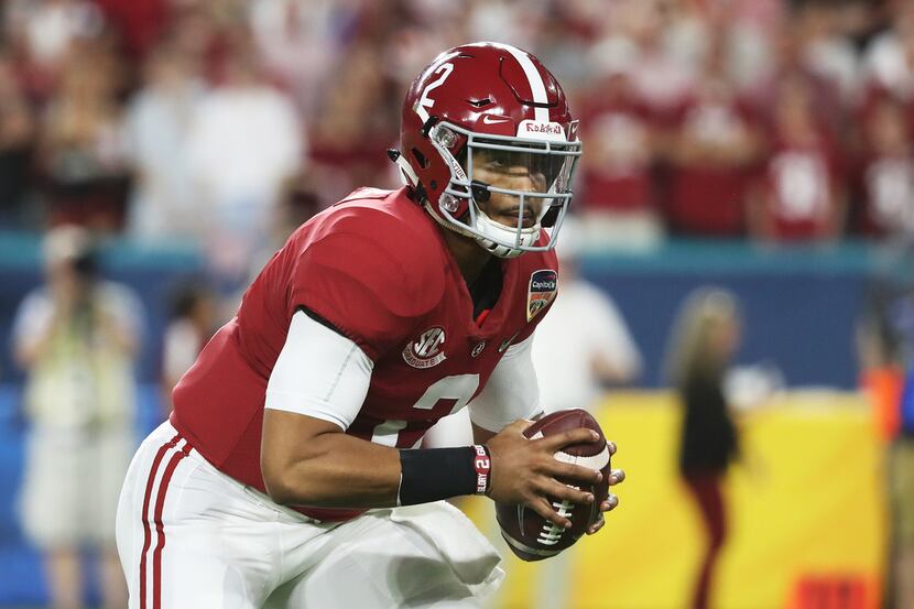 MIAMI, FL - DECEMBER 29:  Jalen Hurts #2 of the Alabama Crimson Tide carries the ball in the...