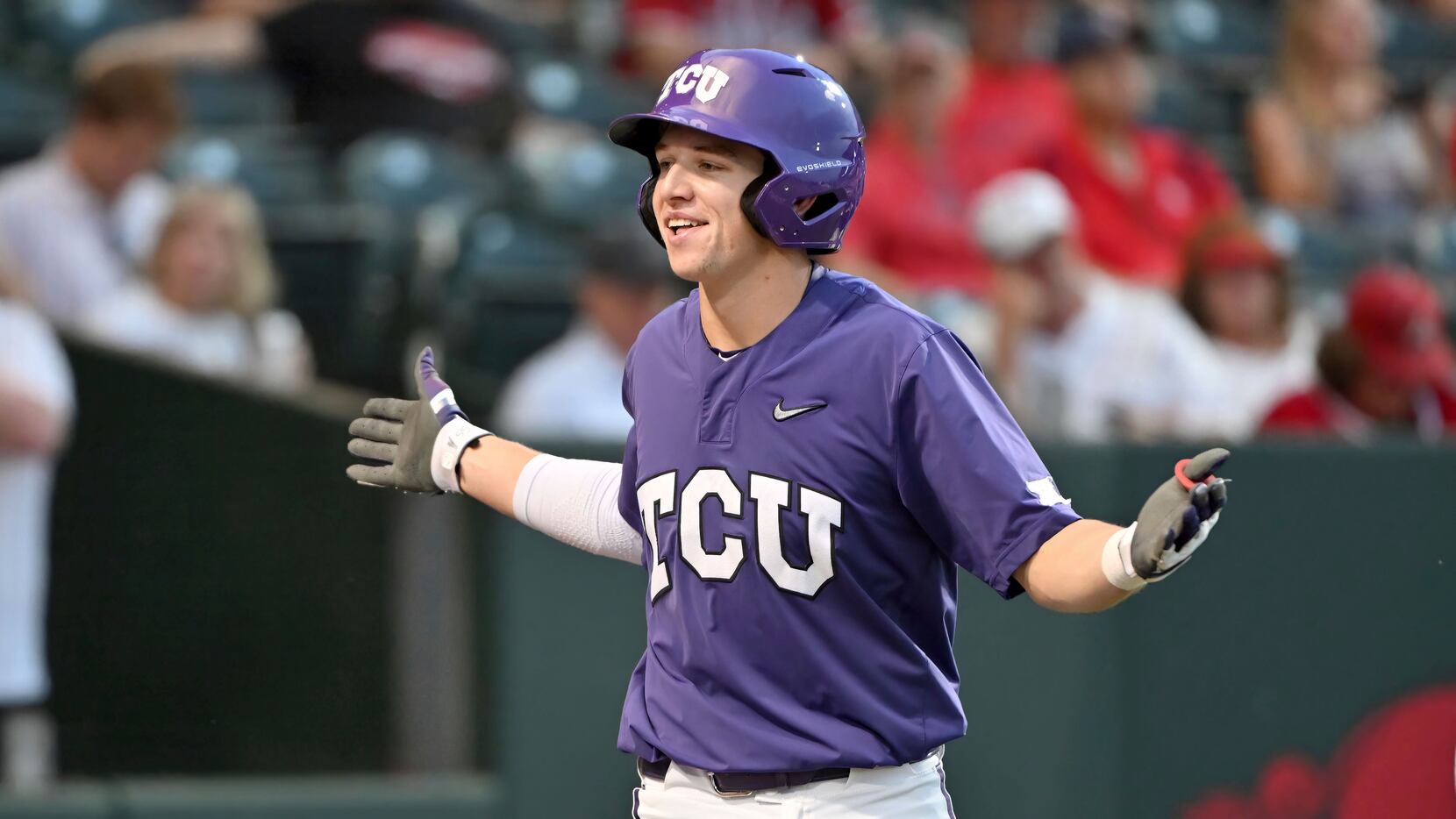 FILE - TCU batter Brayden Taylor celebrates after hitting a home run against Arizona during...
