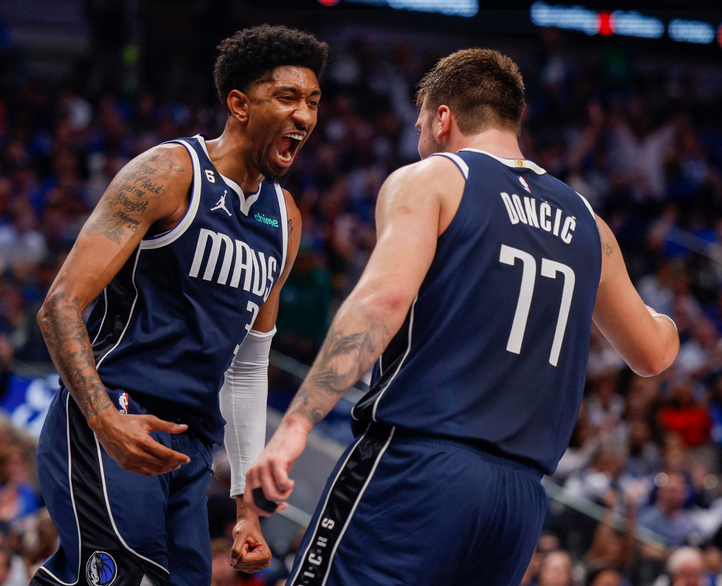 Dallas Mavericks center Christian Wood (35) celebrates after an alley-pop with guard Luka...