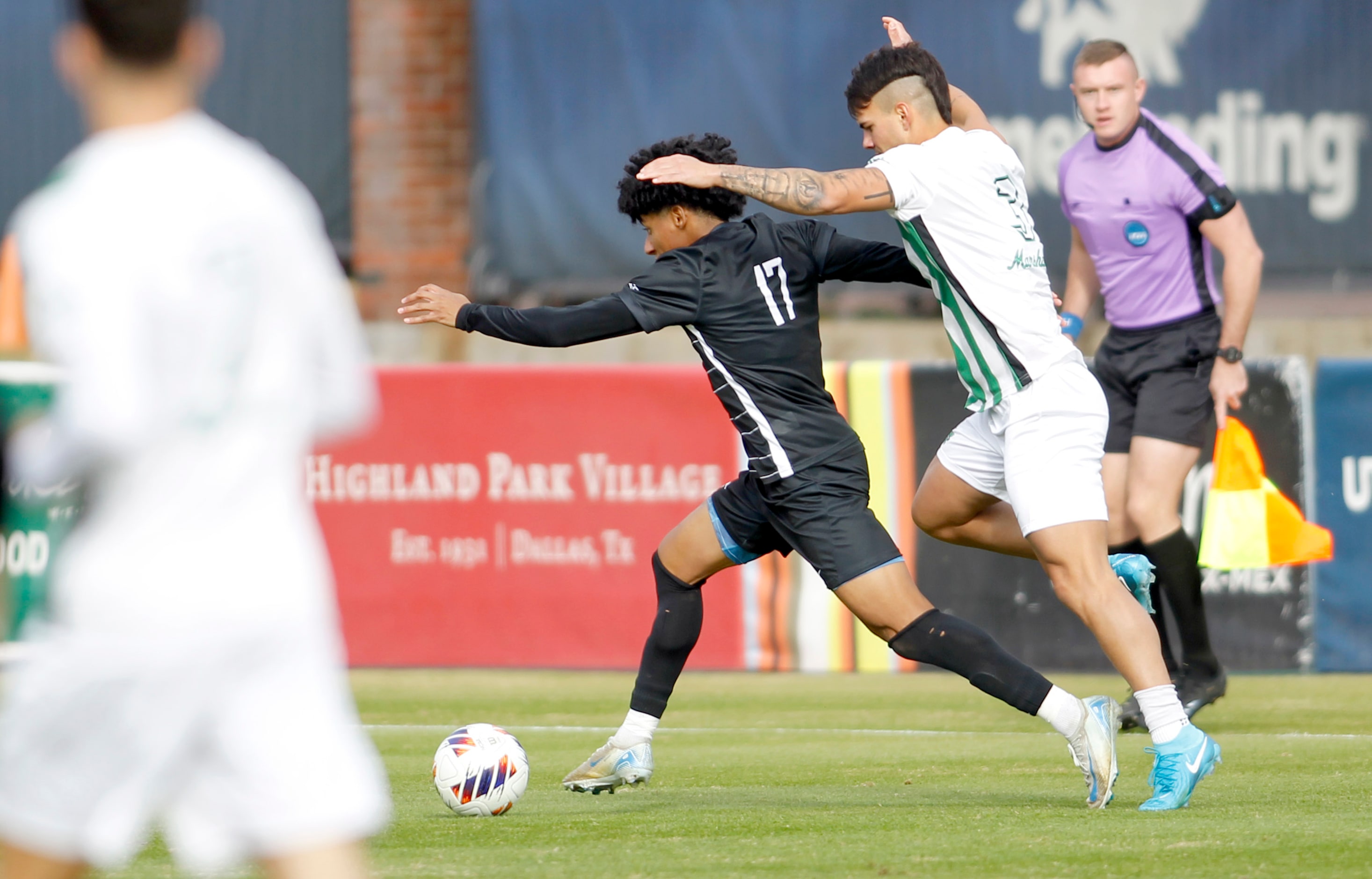 SMU Mustangs midfielder Jalinn Mitchell (17), center, is chased by Marshall midfielder...