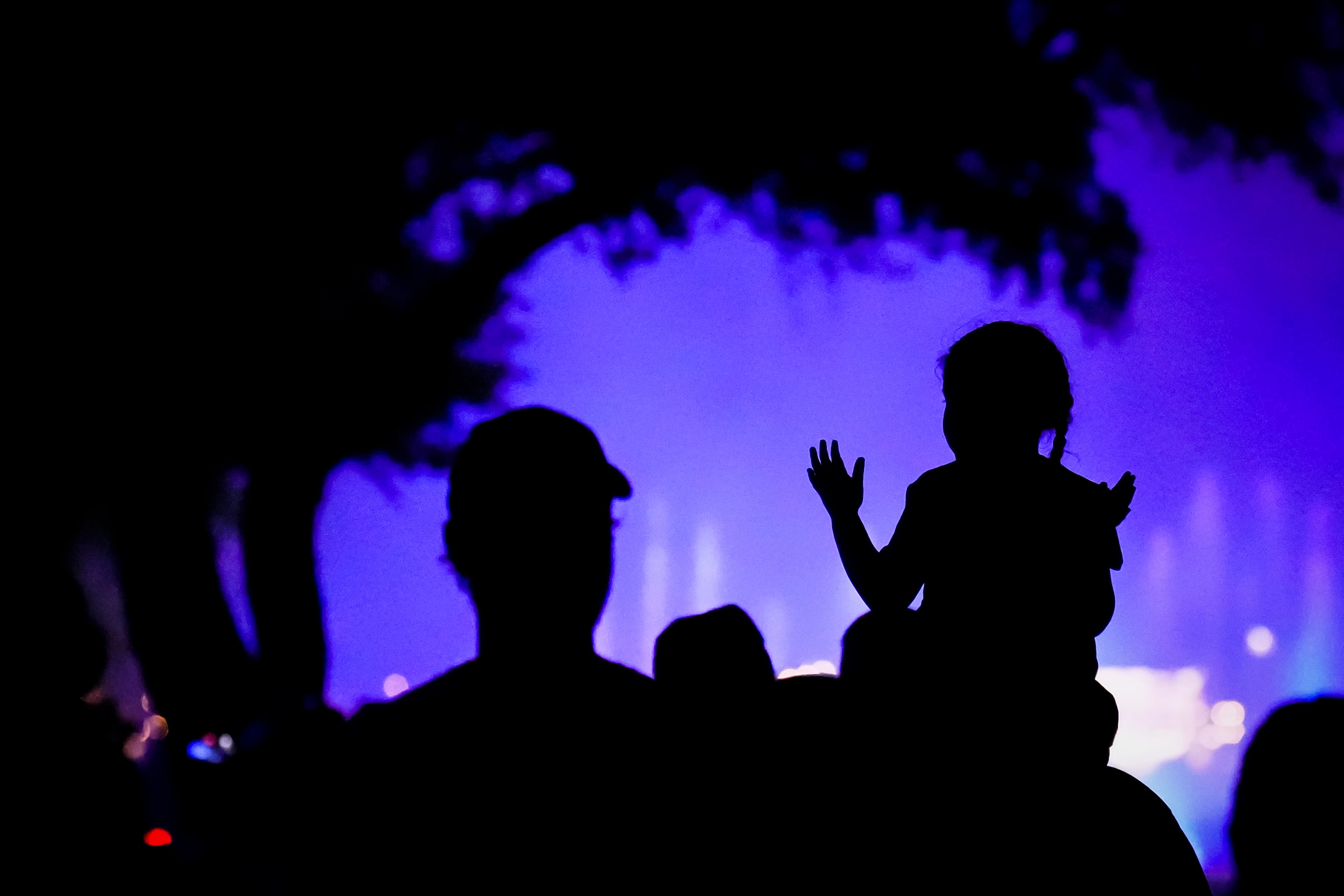 Fairgoers watch the Mattress Firm Illumination Sensation on opening day at the State Fair of...