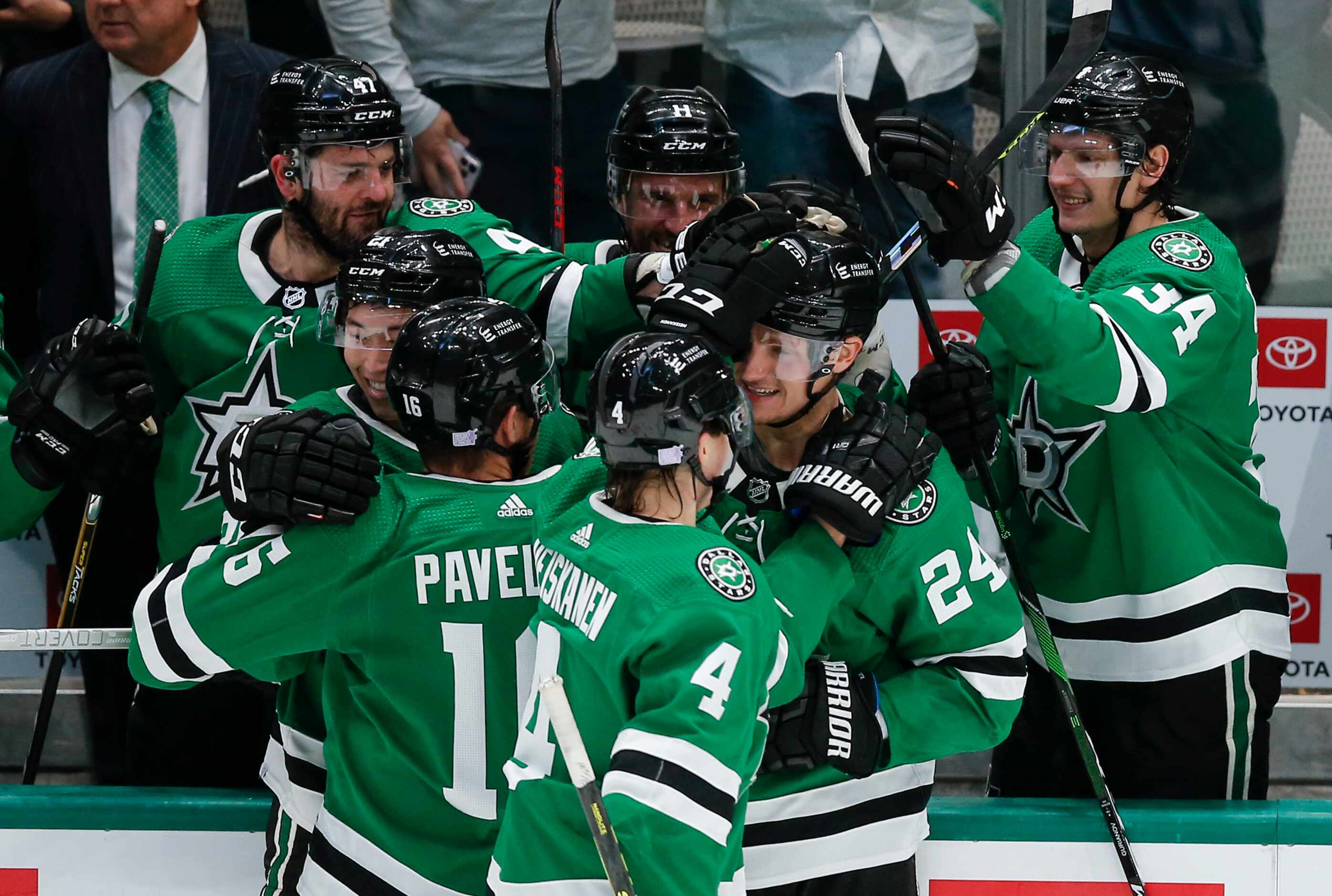 Dallas Stars forward Roope Hintz (24) is congratulated by teammates after scoring an empty...