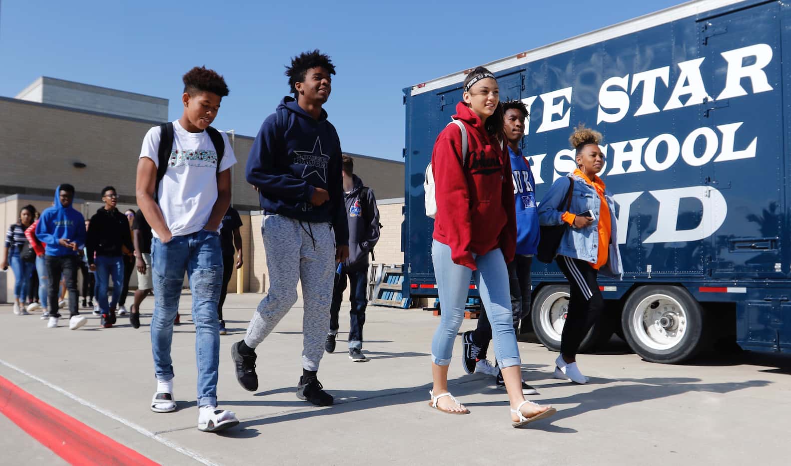Students from Frisco ISD's Lone Star High School students left the school during the...