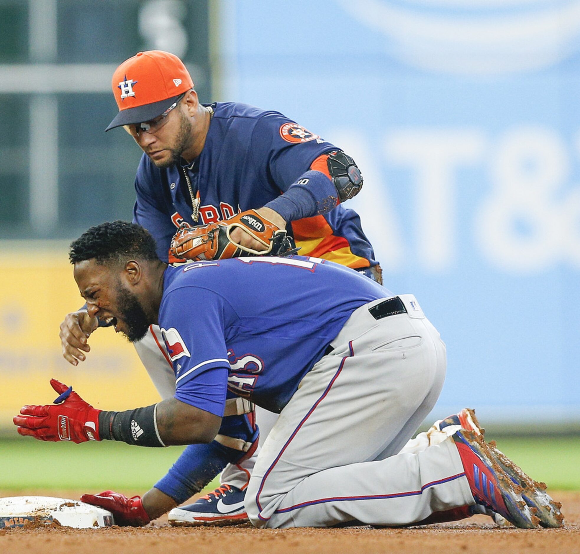 HOUSTON, TX - JULY 29:  Yuli Gurriel #10 of the Houston Astros checks on Jurickson Profar...