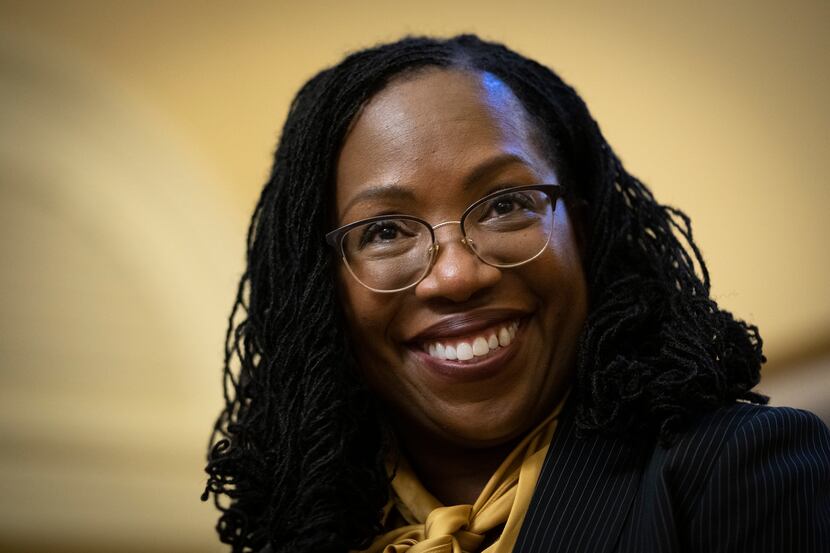 Judge Ketanji Brown Jackson smiles at the beginning of of her meeting with Senate Minority...